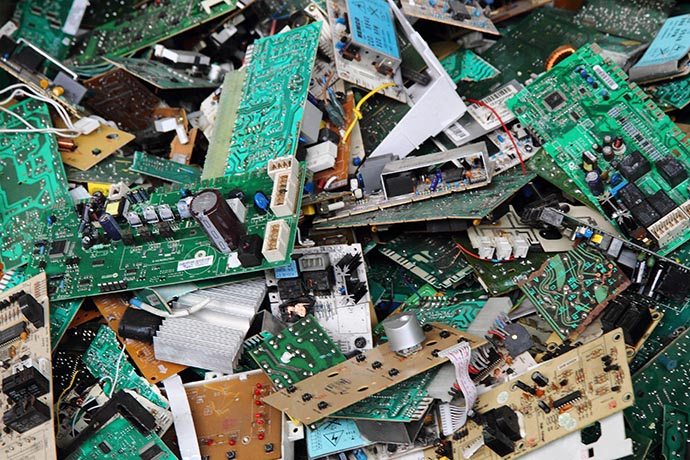 A pile of e-scrap circuit boards for recycling.