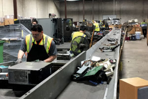 Workers at the CompuCycle e-scrap processing facility.