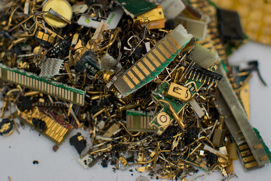 Shredded e-scrap showing gold and other metals.