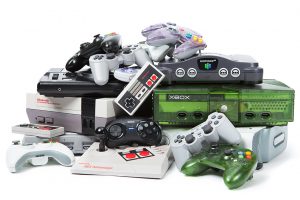 Video game systems and controllers gathered for recycling.