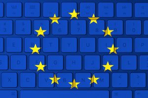 E.U. flag with a keyboard background.