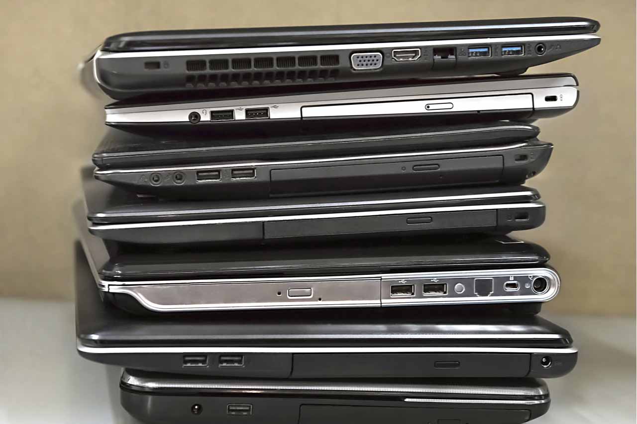 Stacked laptops for resale.