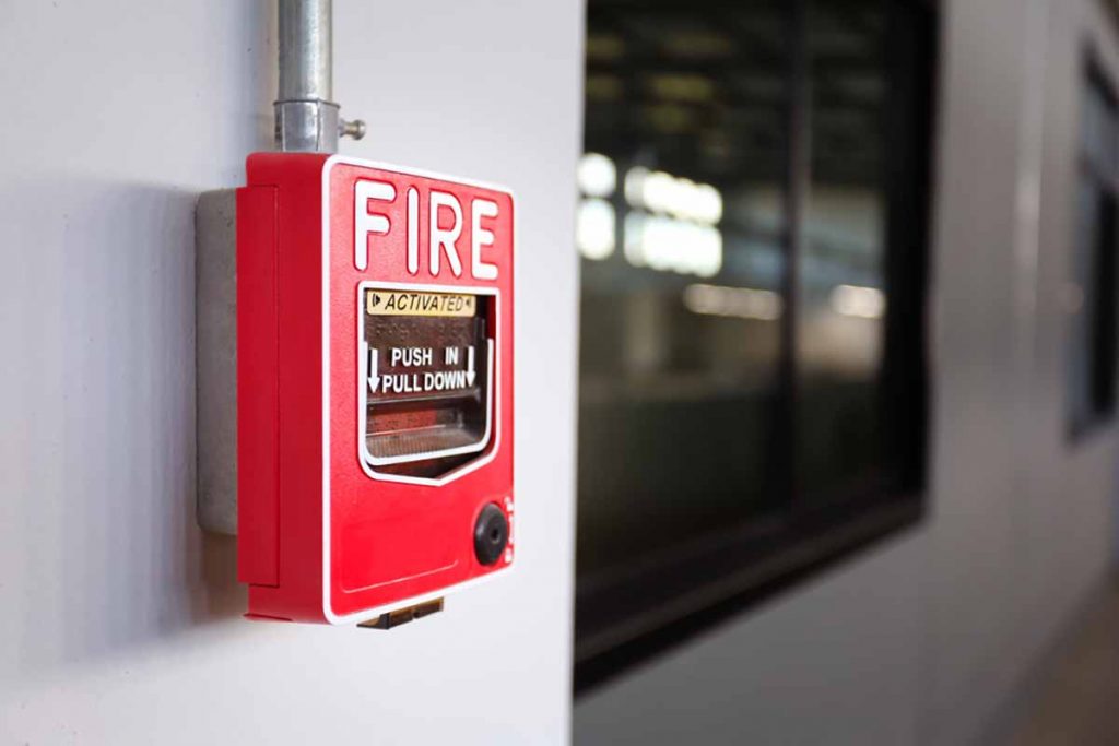 Fire alarm on a facility wall.