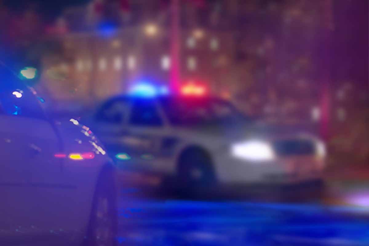 Police cars with lights at night.