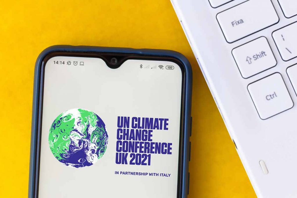 UN Climate Change Conference 2021 logo on mobile phone screen.