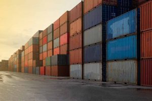 Shipping containers stacked at a logistic hub.