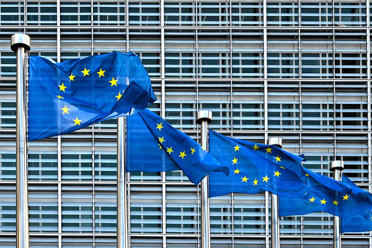 EU flags in front of the European Commission's building.