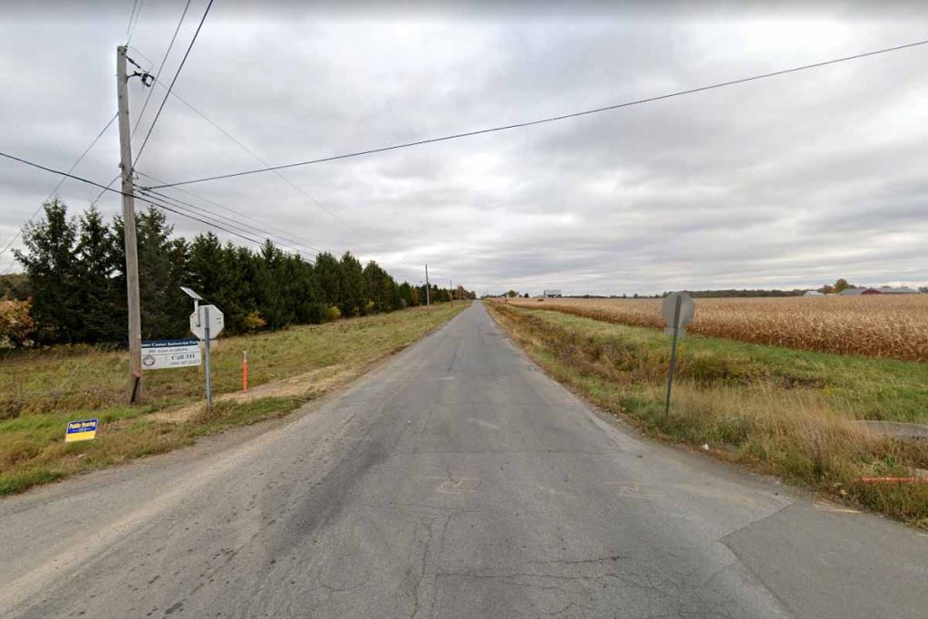 Google Streetview showing farm at right and planned smelter site at left.