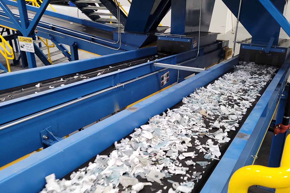Shredded material on a conveyor at the evTerra Las Vegas facility.