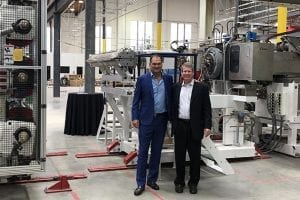 Co-CEOs stand in new rPlanet Earth facility.