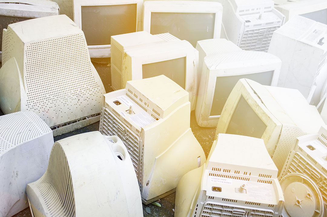 CRT computer monitors gathered for recycling.