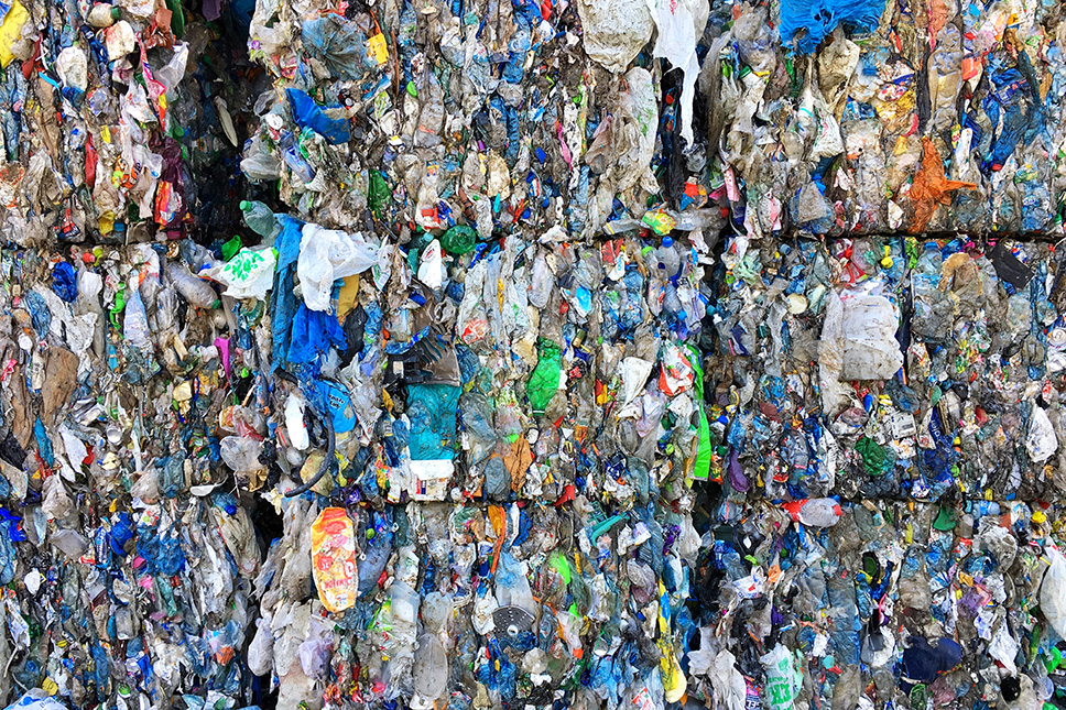 Stacked bales of mixed plastics.