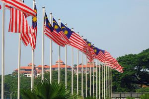 A row of Malaysian flags outside.