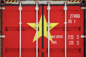 Closeup of a shipping container with Vietnam flag design.