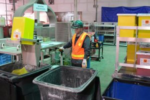 An employee working on the sterilization and cleaning process.