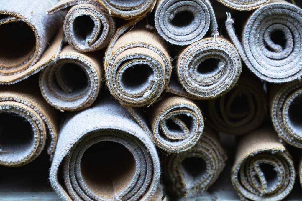 Carpets rolled for recycling.