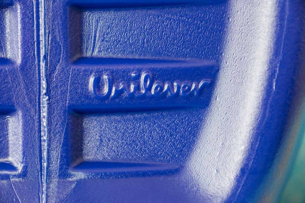 Closeup of a Unilever logo on a product bottle.