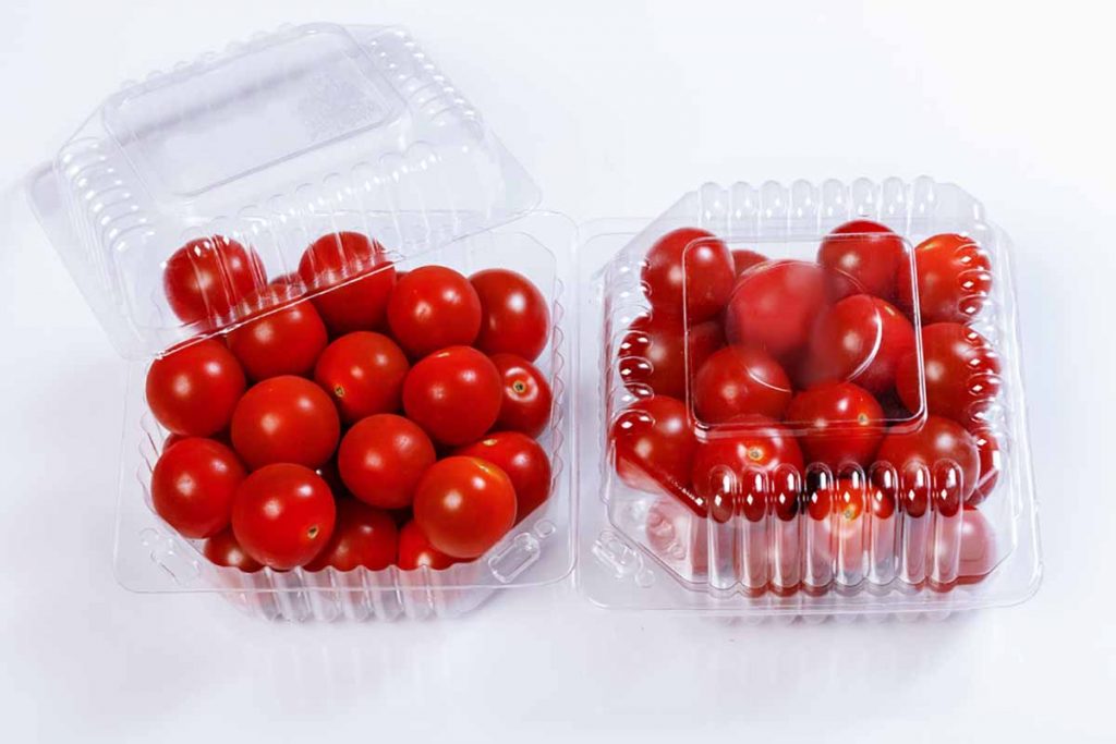 Plastic thermoform packaging containing tomatoes.