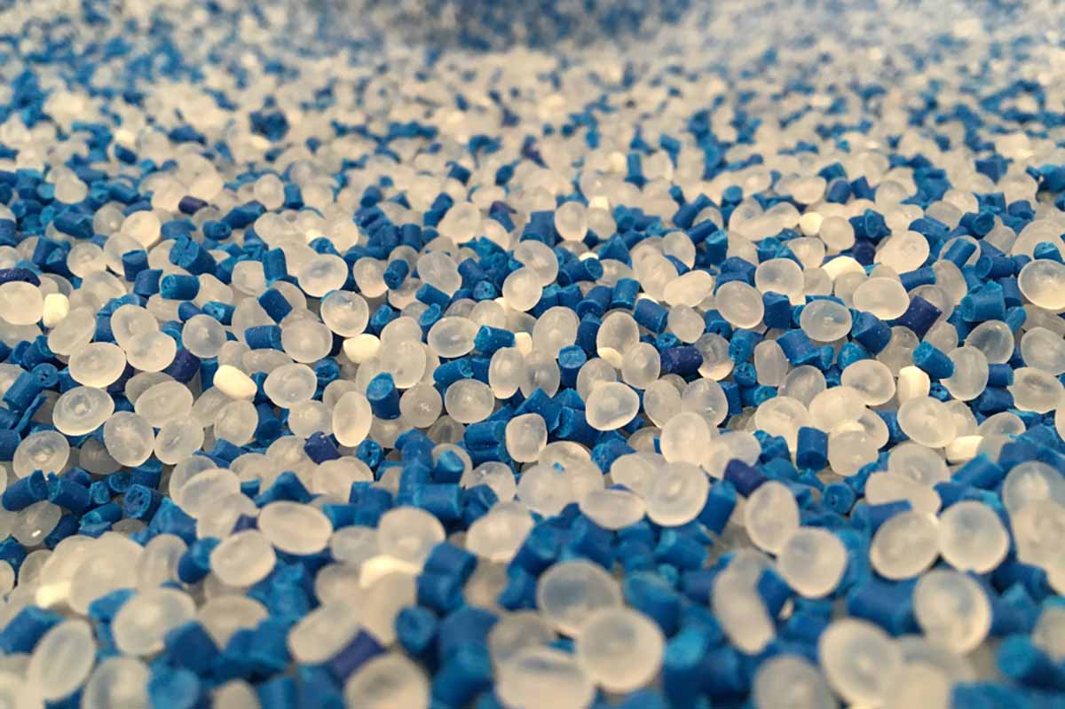 Plastic pellets with blue pigment pellets.