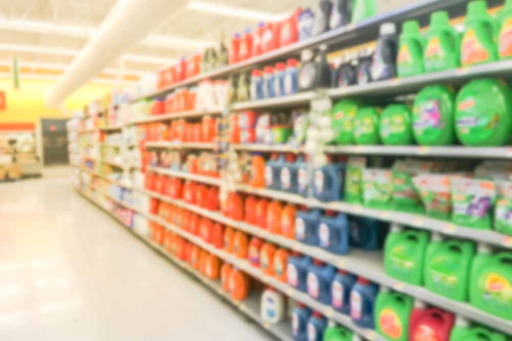 Blurred view of grocery store aisle.