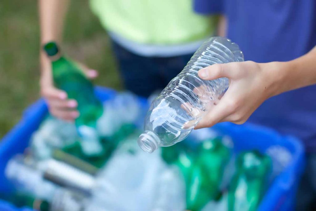 Holding a PET bottle for recycling