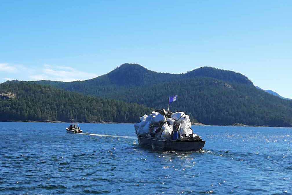 OceanLegacy barge loaded with marine debris for recycling.