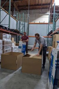 Polycarbin co-founders assembling boxes at the company facility.