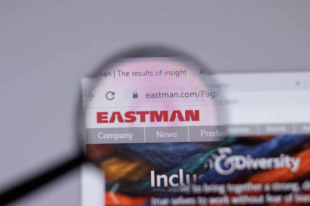 Eastman Chemical Company website on screen with logo under magnifying glass.