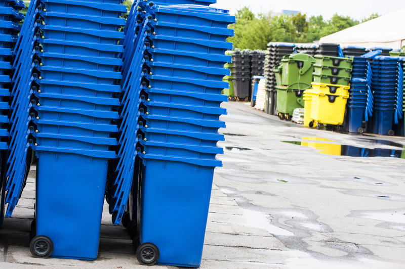 Recycling carts stored before use.