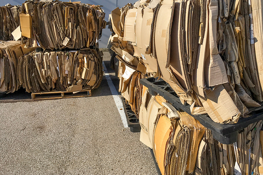 Bales of cardboard gathered for recycling.