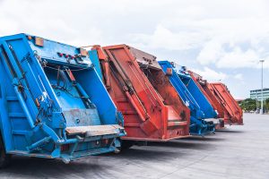 Blue and red hauling trucks parked in a row.