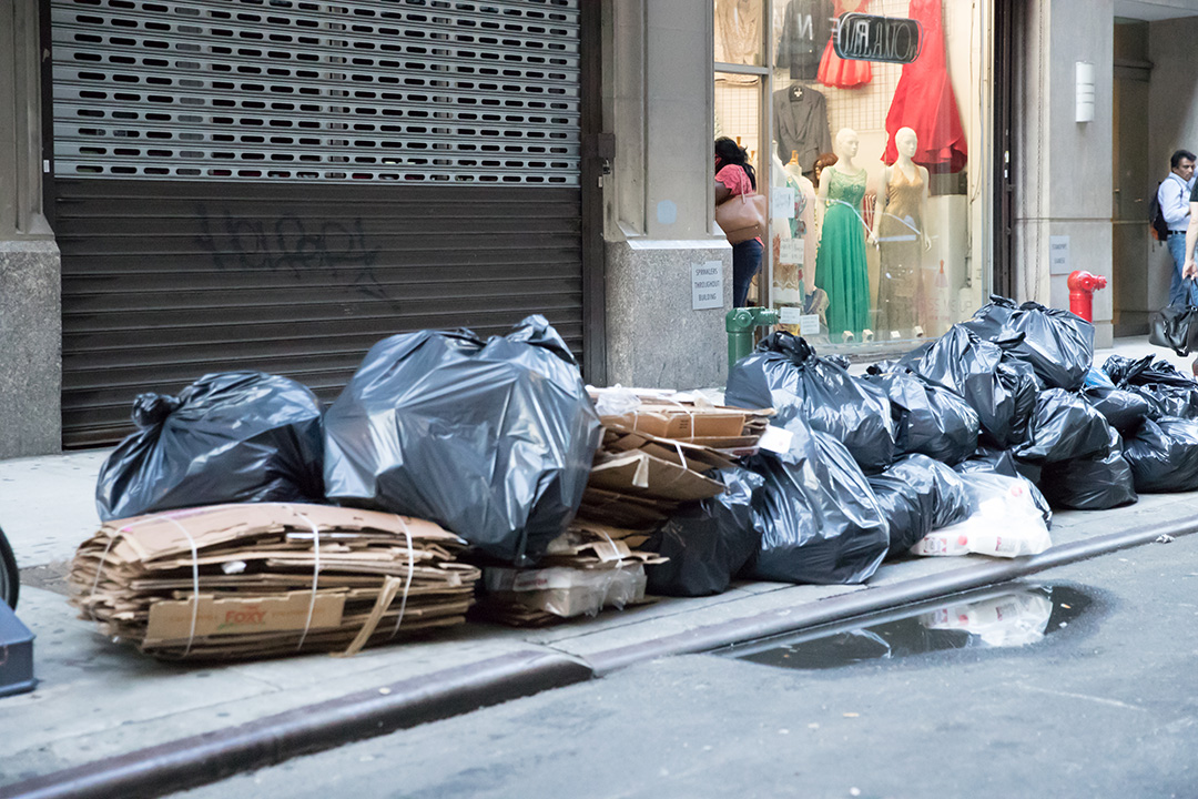 Waste and recycling on a street in New York City.
