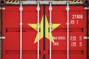 Closeup of cargo container with a Vietnam flag painted on.