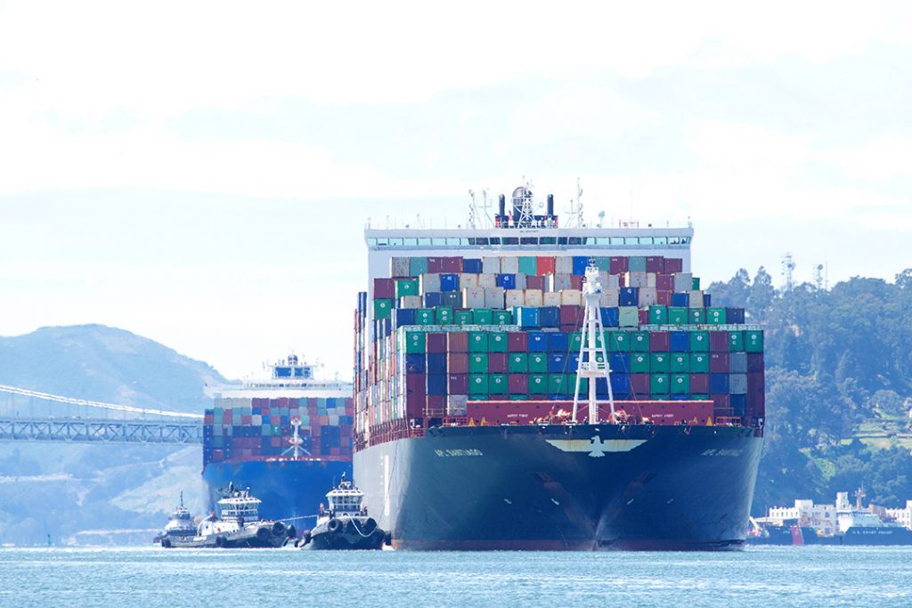 Cargo transport ships on the water.