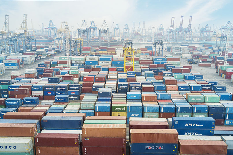 Containers and cranes at a port in Jakarta, Indonesia.