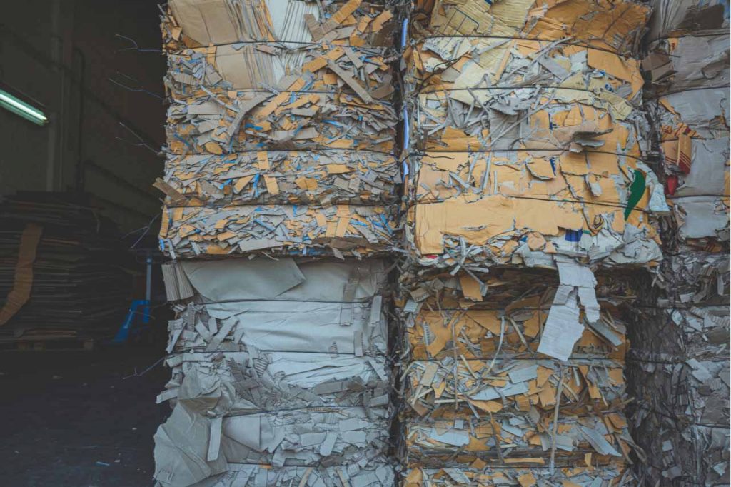 Fiber bales stacked for recycling.