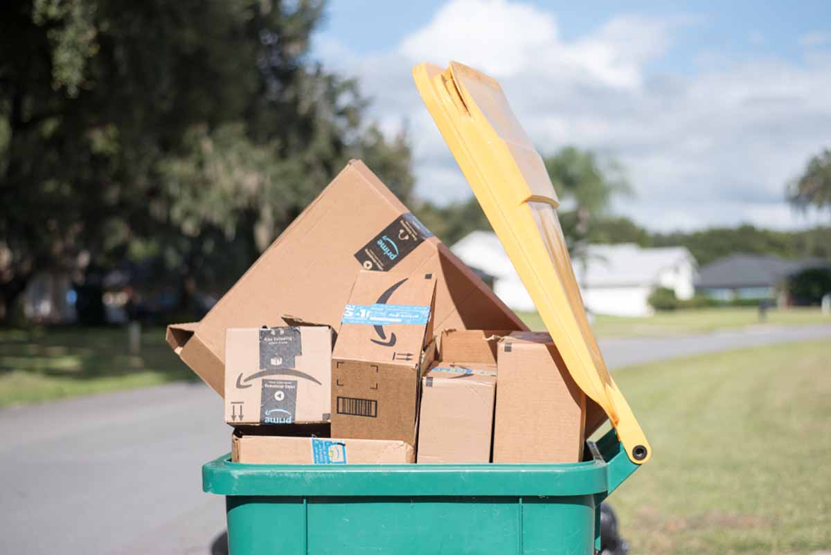 Recycling bin full of cardboard boxes.