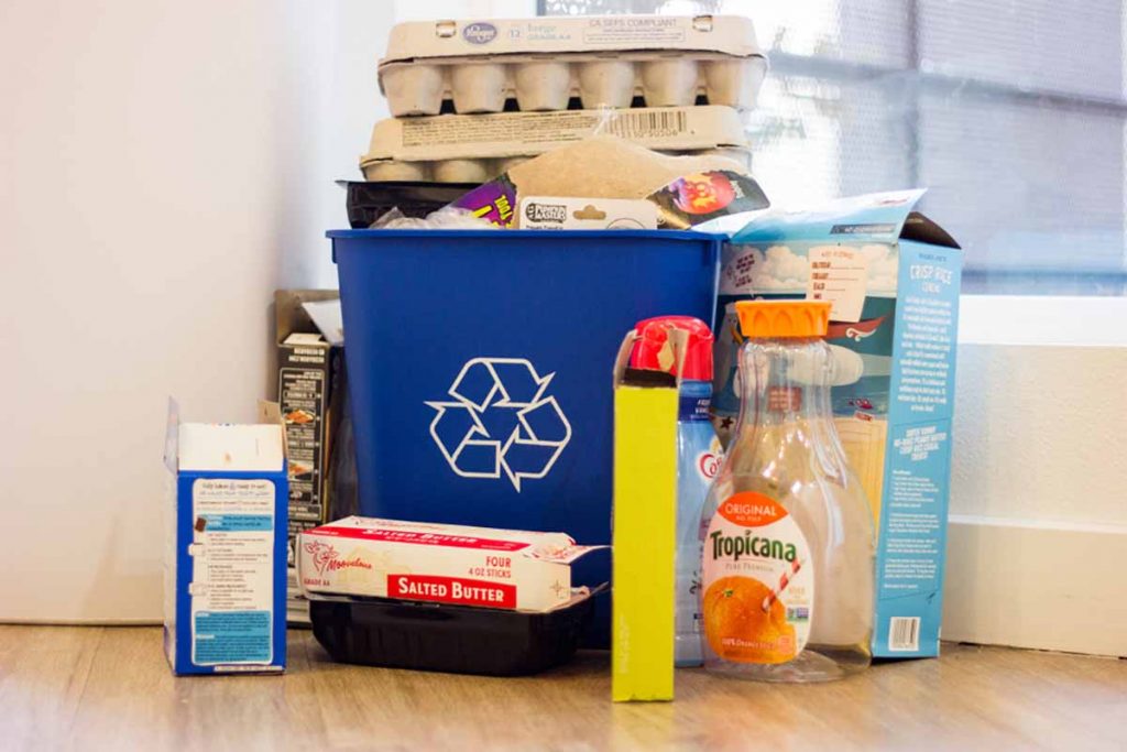 Household recycling bin with various packaging.