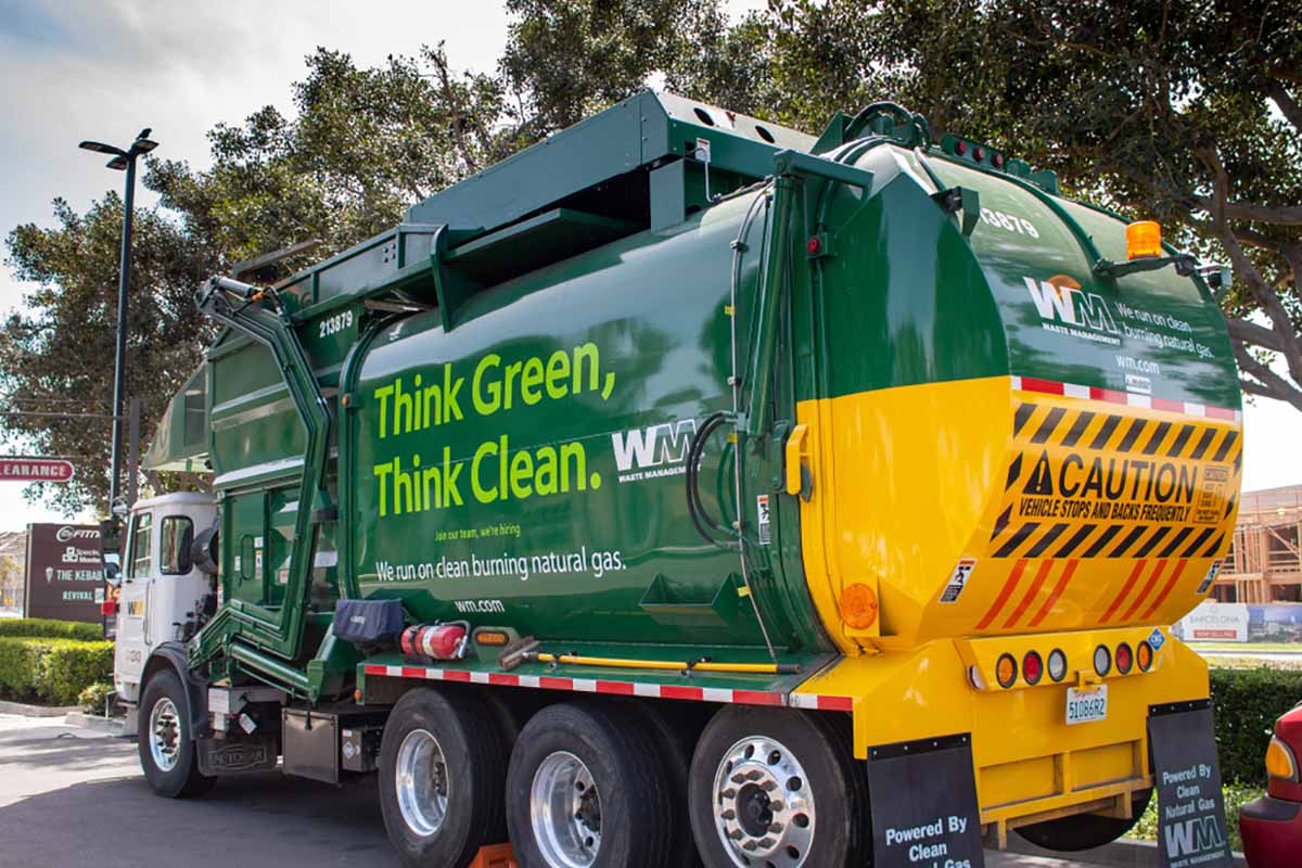 Waste Management truck on a public street.