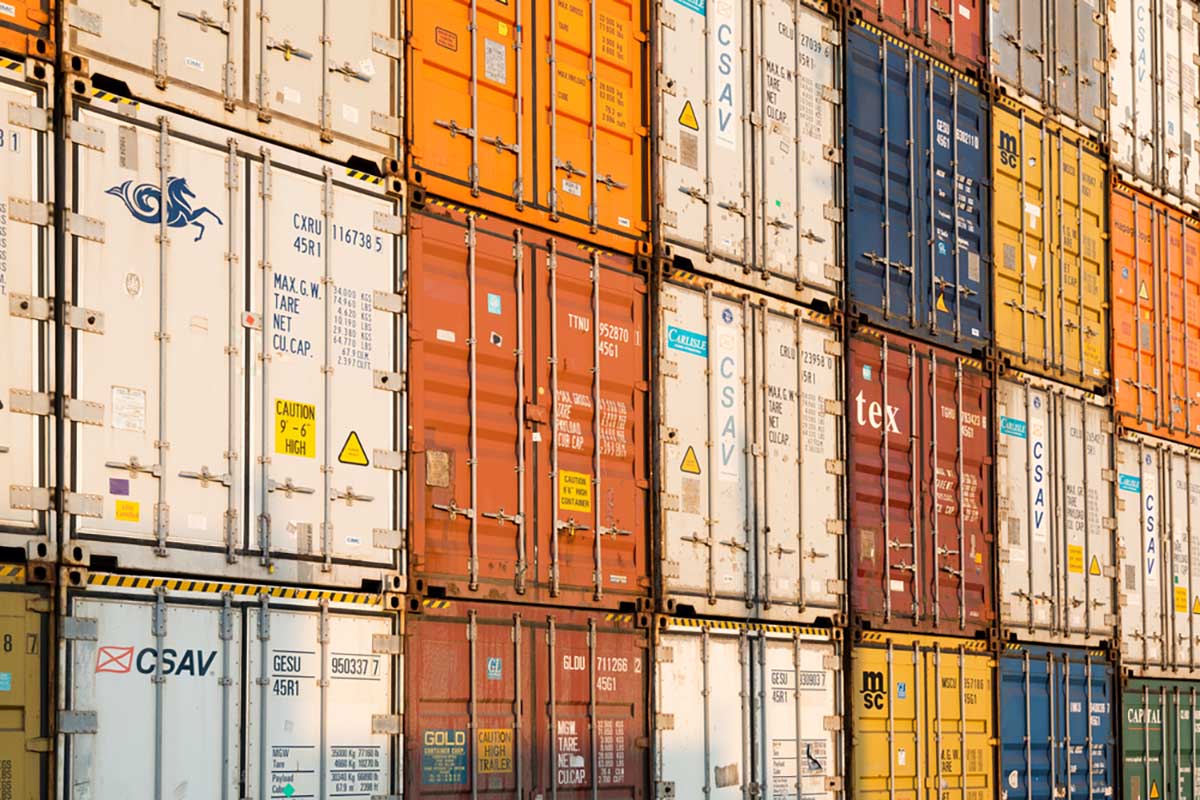 Shipping containers stacked at a port.