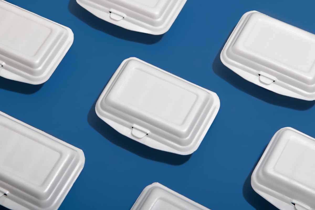 PS foam containers on blue background.