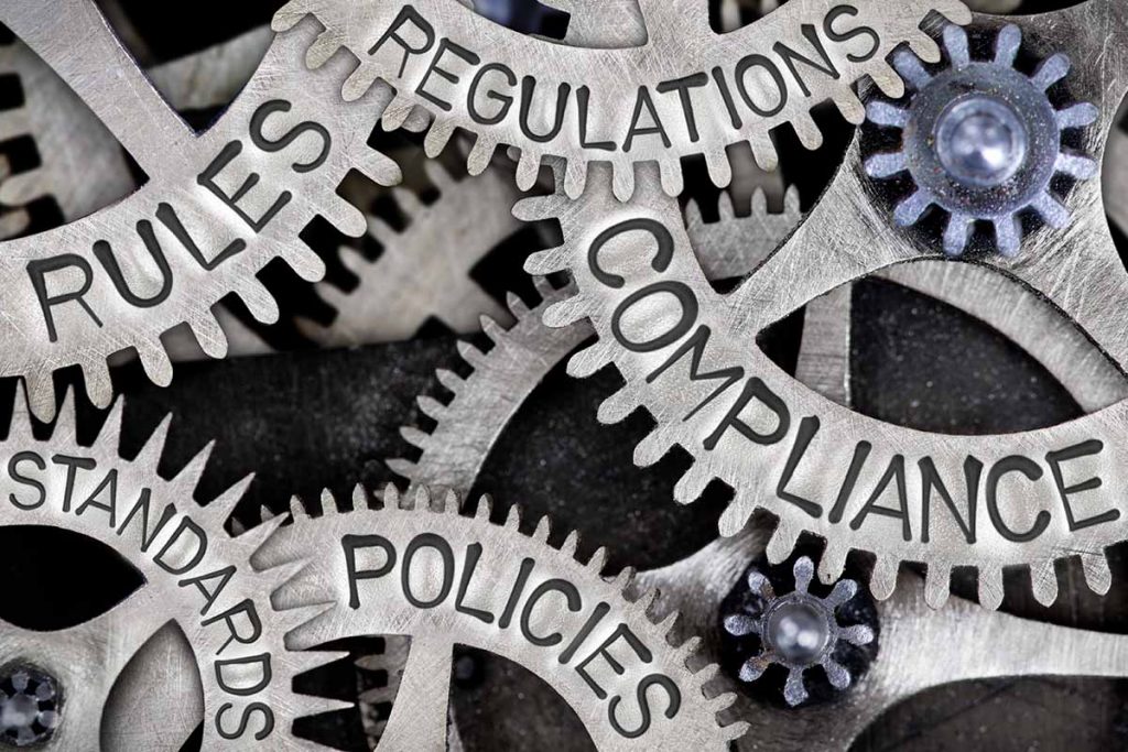 Graphic showing cogs of rules, regulations, compliance, standards and policies.