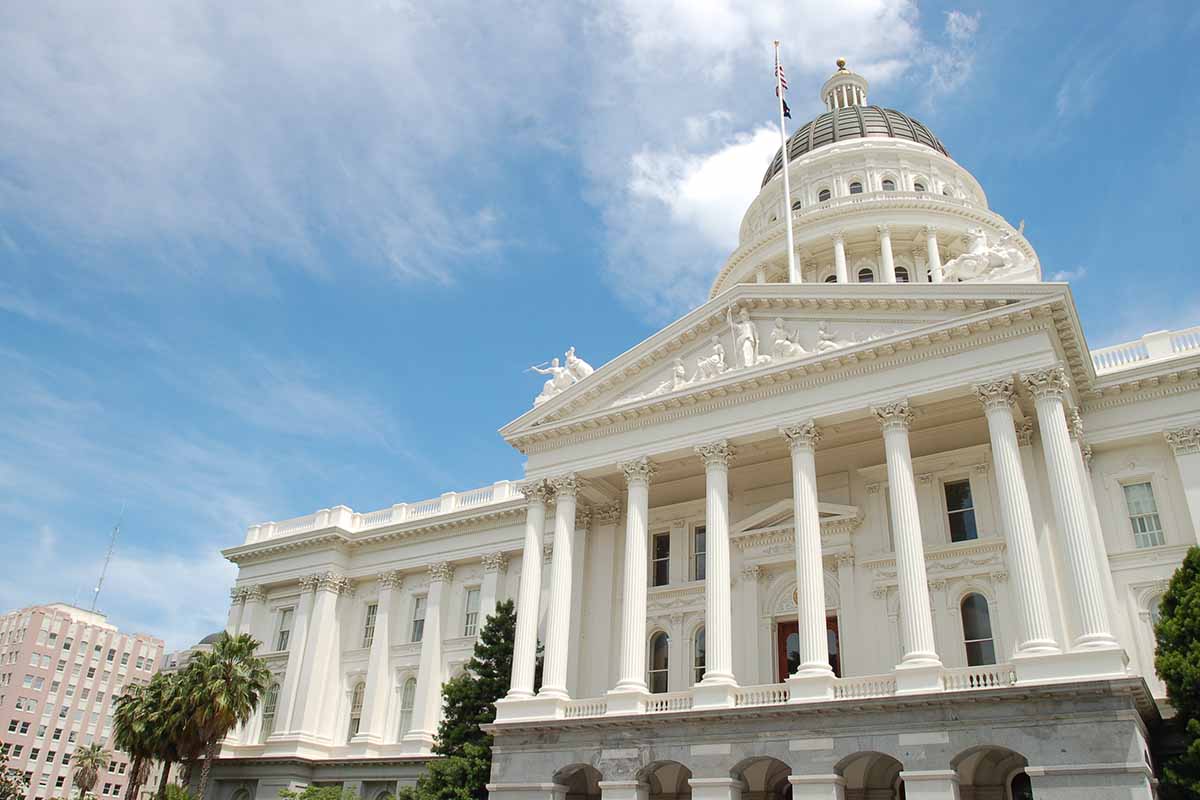 California's state capitol building seen with blue sky above.