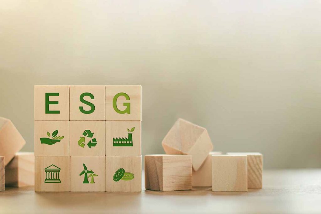 ESG letters and symbols on wooden blocks.