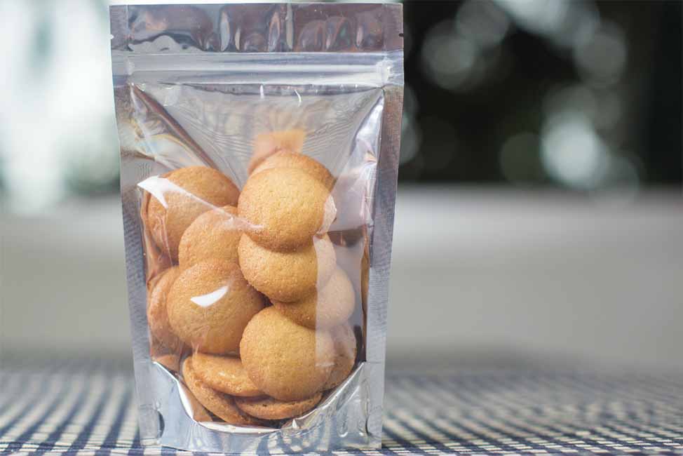 Cookies in flexible packaging on a table.