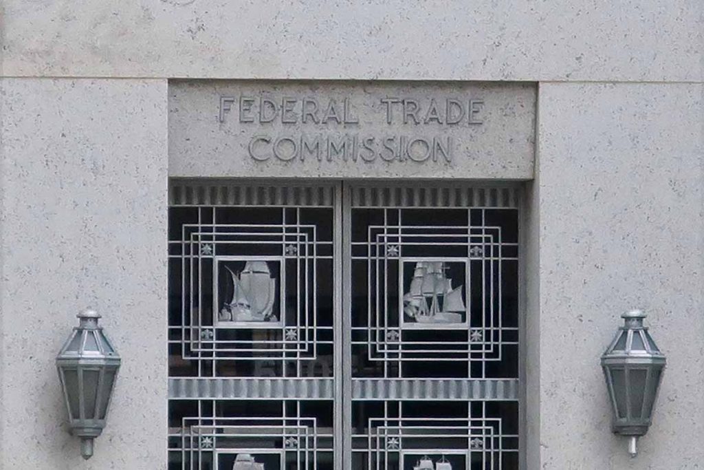 Federal Trade Commission building with sign above door.