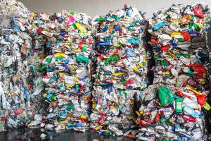 Plastic pressed bales at the modern waste hazardous processing plant. Separate garbage collection. Recycling and storage of waste for further disposal. Business for sorting and processing of waste.