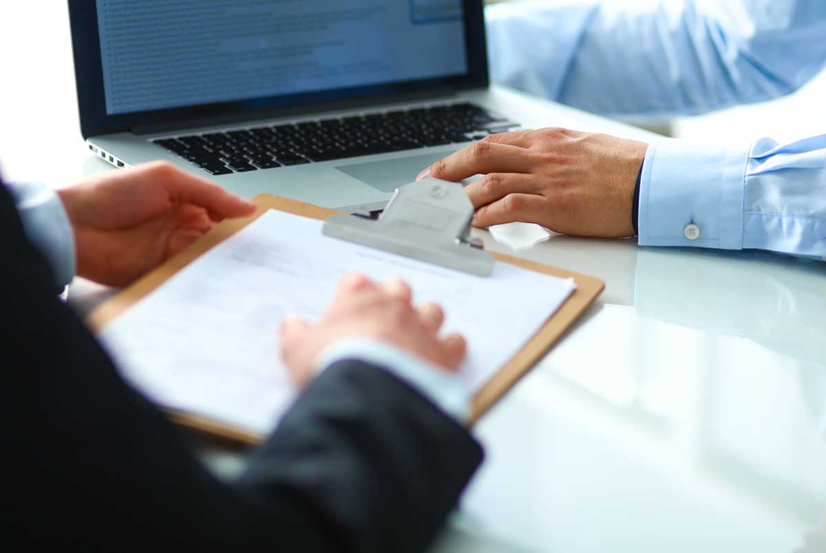 Business meeting at a laptop.