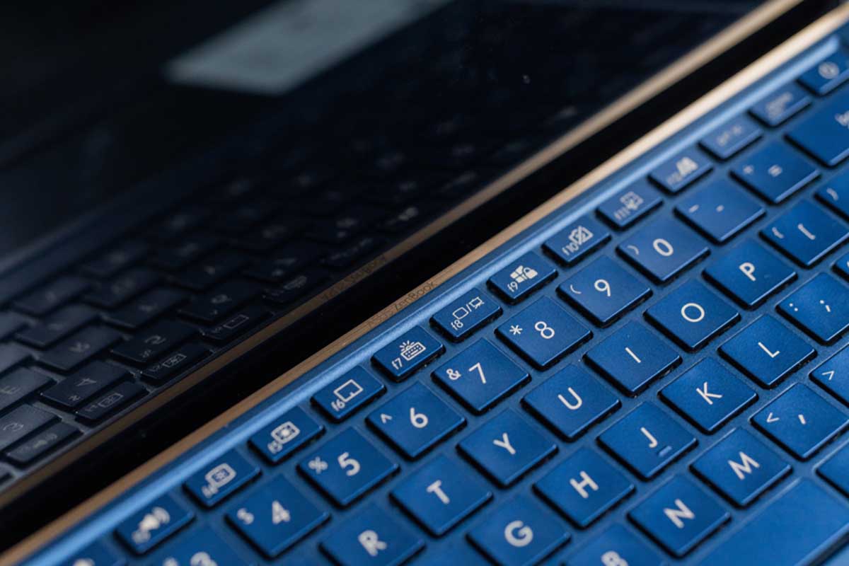 Closeup on laptop screen and keyboard.