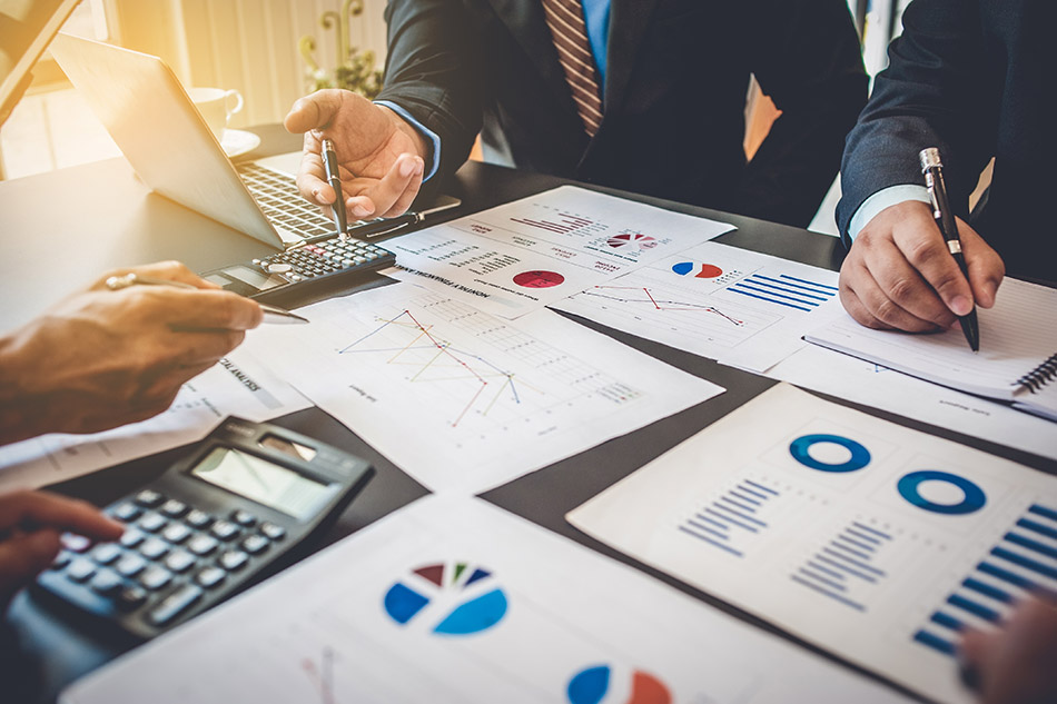 Business meeting with documents on table.